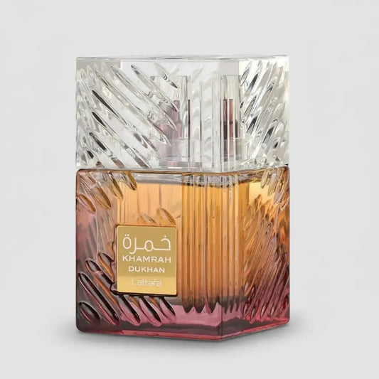 Lattafa Khamrah Dukhan unisex fragrance spray by D'La Moda, 3.4 oz / 100 ml, with a sleek perfume bottle and elegant design.