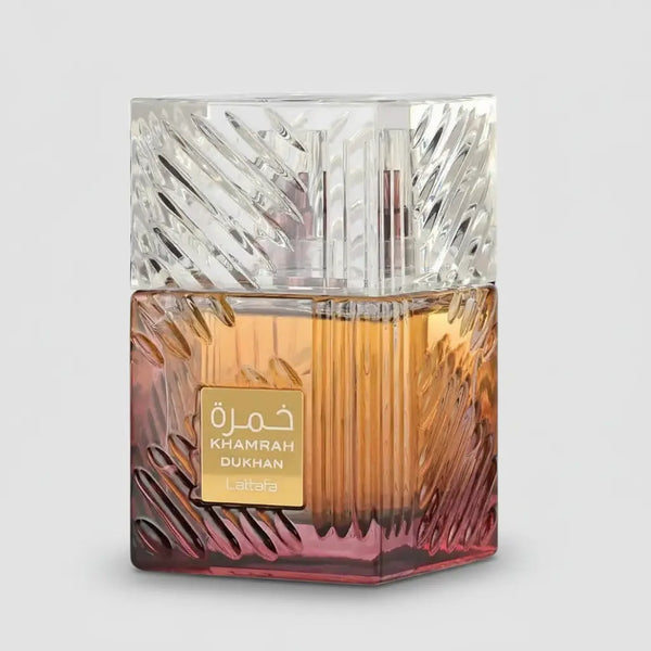 Lattafa Khamrah Dukhan unisex fragrance spray by D'La Moda, 3.4 oz / 100 ml, with a sleek perfume bottle and elegant design.